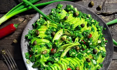 Salad with avocado herbs and capers