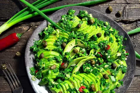 Salad with avocado herbs and capers