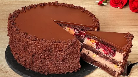 layered cocoa cake with cream and fruit