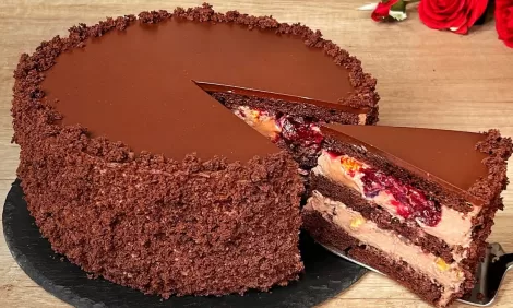 layered cocoa cake with cream and fruit